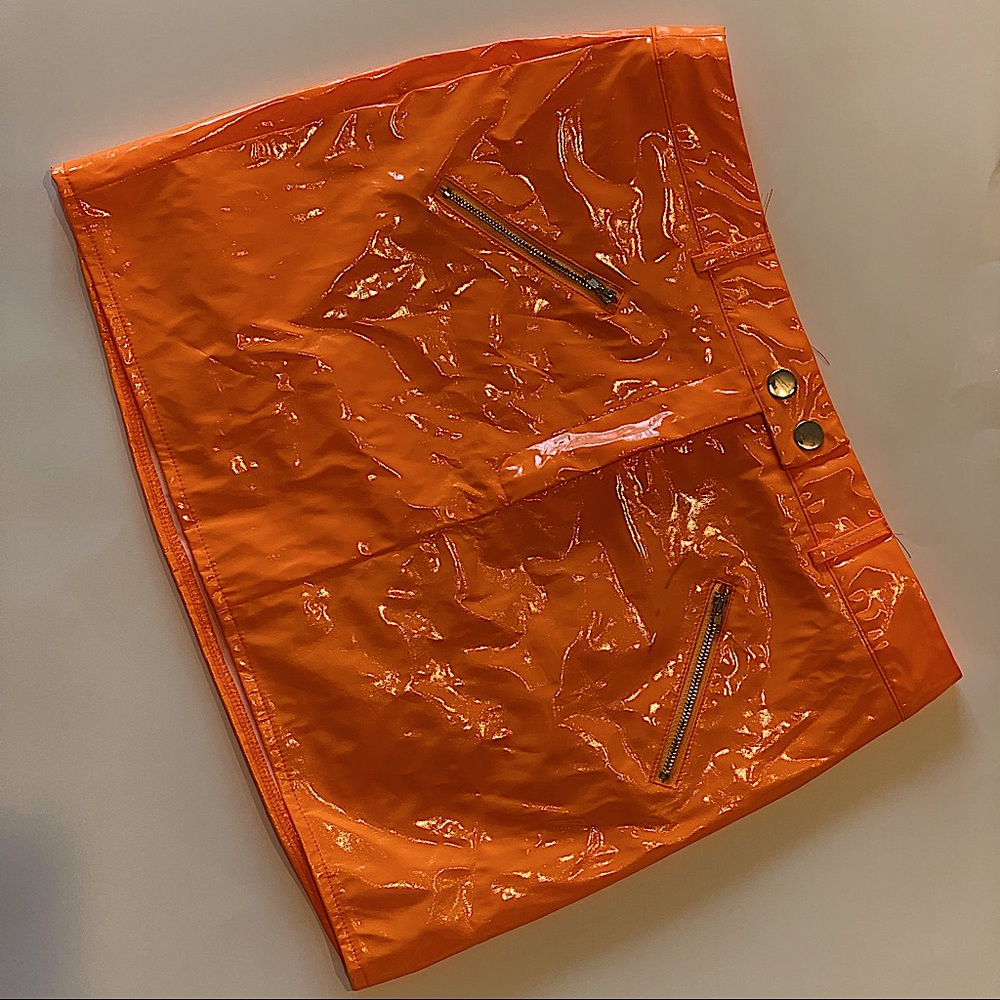 A cute faux leather orange skirt with slip